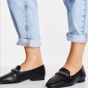 Black loafers with chain detail